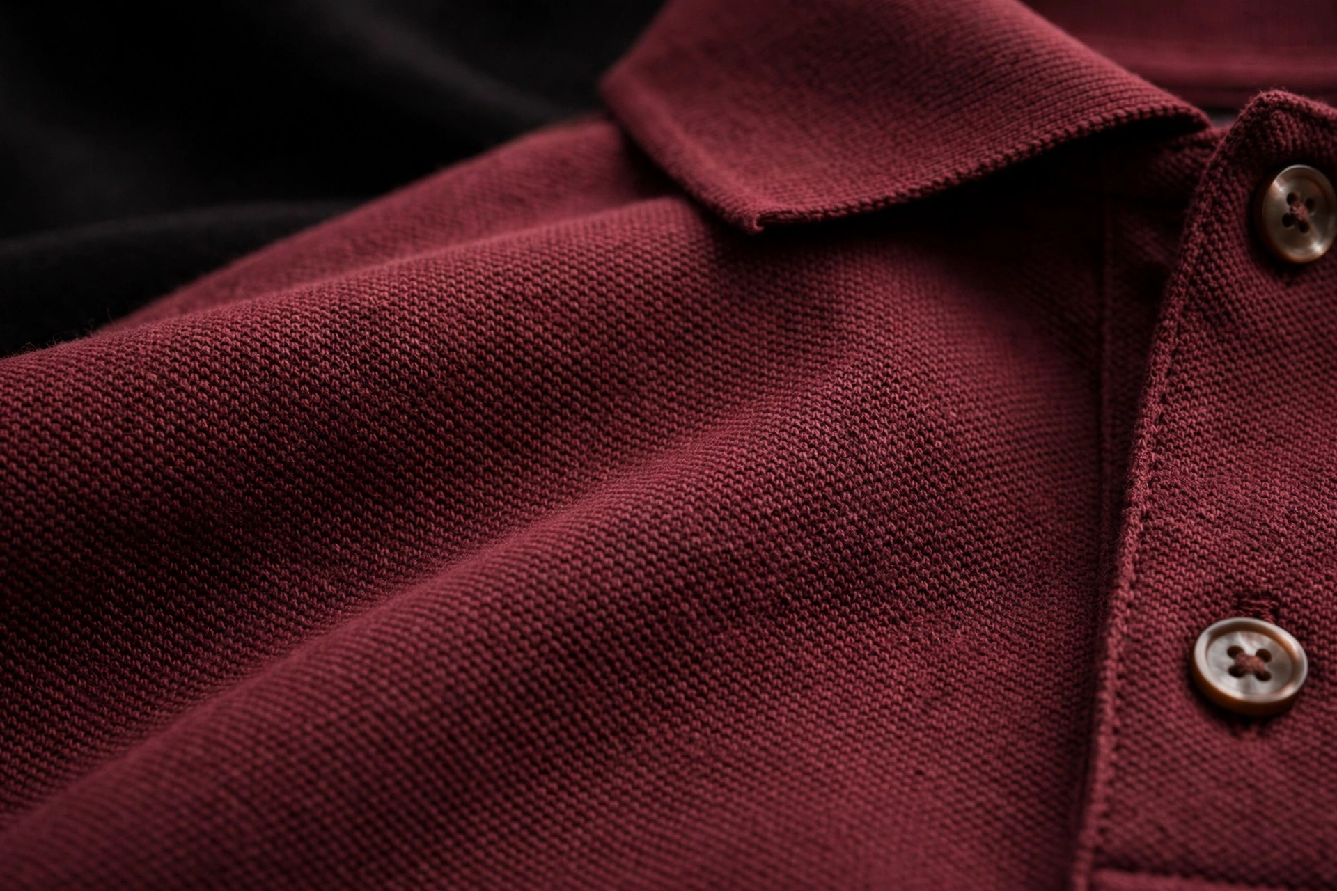 BLAKE ESSENCE The Polo — maroon pique polo fabric close-up with collar and buttons